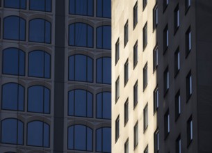 Architectural styles of two adjacent modern buildings in New York, capturing their unique facades