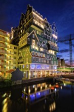 ZAANDAM, NETHERLANDS, MAY 21, 2018: Inntel Hotel in Zaandam illuminated at night. Design of