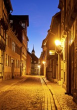 Half-timbered houses in a narrow street with cobblestones, Old Town in the evening, World Heritage