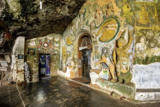 Walls of the cave with detailed paintings and sculptures that tell a spiritual story, The Diva