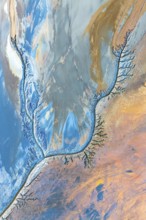 Abstract fractal work featuring dynamic patterns in vibrant blues, oranges, and earth tones. The