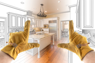 Male Contractor Hands Framing Completed Section of Custom Kitchen Design Drawing