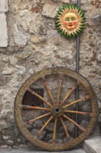 Wheel of a Sicilian cart, Italian Carretto siciliano, Sicilian Carrettu sicilianu and a typical