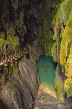 Beautiful colours inside the Iris Grotto at the Cola de Caballo Waterfall in the Monasterio de