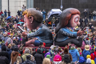 Rose Monday procession in Düsseldorf, theme car by wagon manufacturer Jacques Tilly, topic of