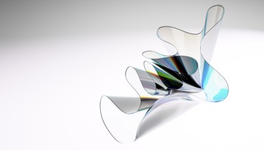 A captivating abstract sculpture of translucent curved glass with reflective surfaces on a soft