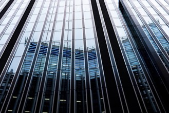 Modern abstract reflections in glass fronted commercial office buildings in the financial district