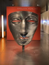 Oversized exhibit in Varusschlacht Museum replica of mask face mask of Roman legionary cavalry