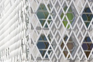 Abstract view of a auditorium facade showcasing geometric patterns of interlocking diamond shapes