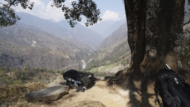 Far reaching view from a vantage point over a river valley and mountain landscape, two large