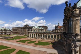 The Zwinger Palace in Dresden, Germany, showcases its stunning baroque architecture under a vibrant