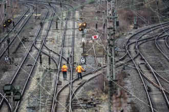 Railway employees check the tracks and switches at the Hagen-Vorhalle marshalling yard, is one of