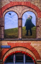 Artistic wall design on the Sumatraweg, scene strongly reminiscent of the surrealist works of René