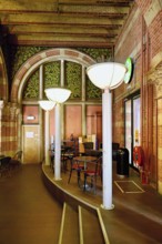Interior view of coffee at Centraal Station, Central Station with flag, Amsterdam, Netherlands