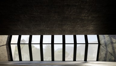 Large geometric windows frame a scenic view, with natural light illuminating the textured concrete