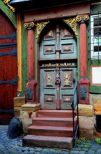 Renaissance door with painted wood carvings in a half-timbered house, historic centre, Alsfeld,