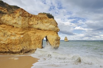 Rocky coast and beach in the surf, Praia do Camilo, Lagos, Algarve, Portugal