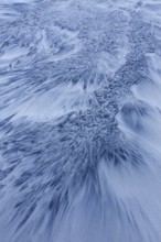 Patterns in the sea sand at beach along the coast in winter