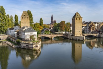 The towers of the Ponts Couverts Covered Bridges on the Ill and the cathedral in Strasbourg,
