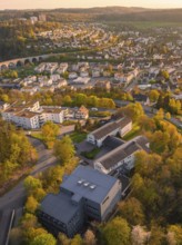 Aerial view of an urban area with houses and trees in a hilly landscape, Nagold, Black Forest,