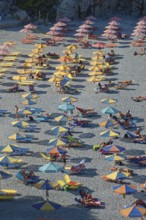 Colourful Ahata beach full of umbrellas and people relaxing and enjoying the sun, Ahata Beach,