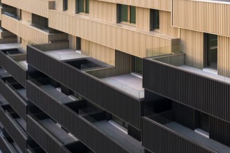 This image showcases a modern apartment building characterized by vibrant colorful portals and a