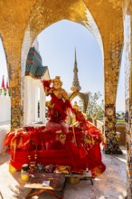 Round arch pavilions decorated with colorful mosaics and glass works of art, including a gilded