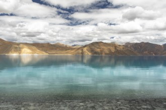 A stunning view of Pangong Tso lake in Ladakh, India, with its crystal-clear turquoise waters