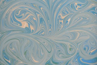 An abstract floral pattern with swirling blue and beige acrylic paint. This dynamic design creates
