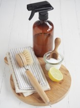 Natural cleaning products. Liquid cleaner in glass spray bottle, lemon and baking soda. Reusable