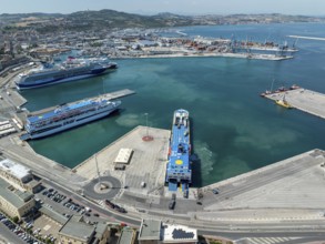 Aerial view of Ancona harbor, Italy, showcasing cruise ships docked at the port, surrounded by