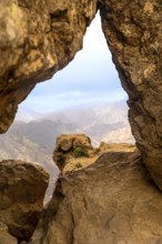 Roque nublo volcanic rock formations framing a scenic mountain view during a hike in gran canaria,