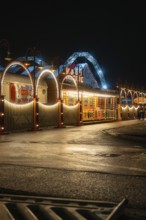 Atmospherically illuminated circus with arches and lamps at night, Böblingen, Germany