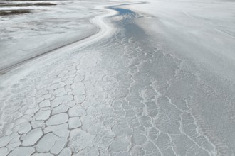 A mesmerizing aerial view of a saline mud landscape, showcasing intricate natural patterns and