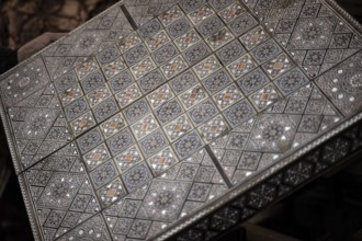 Damascus, Syria. December 10th 2025. Close-up detail of a handmade mosaic wooden backgammon box