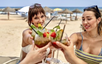 Friends gather on a sunny beach, enjoying colorful cocktails while celebrating summer. Laughter and
