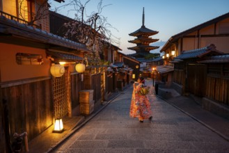 Japanese woman wearing kimono in an alley, Yasaka dori historic alleyway in the old town with