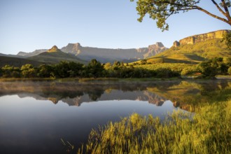 Sunrise, amphitheatre with reflection in the lake, Royal Natal National Park, Drakensberg Mountains