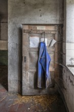 Door with rubber apron in the abandoned cowshed of a former LPG of the GDR, Mecklenburg-Vorpommern,