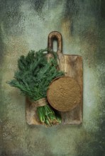 Dried dill, in a ceramic bowl, a bunch of fresh dill, seasoning, top view, no people