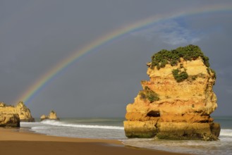Rocks on beach with rainbow, Praia Dona Ana, Lagos, Algarve, Portugal