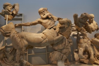 West pediment of the temple of Zeus, battle between lapiths and centaurs, dramatic battle scene in