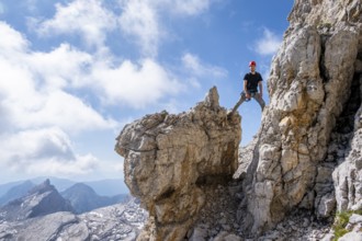 Mountaineer standing on a rock, Via Ferrate Benini via Ferrate, Brenta Mountains, Brenta-Adamello