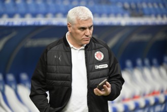 Andreas Bornemann. FC St. Pauli managing director of sports on smartphone mobile soccer Bundesliga,
