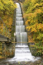 Cascade for power generation at the Rabenauer Grund hydroelectric power plant in autumn, Rote