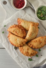 Fried chebureks, close-up, on a light background, no people