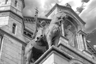 Equestrian statue of King Saint Louis in front of the Sacré-Cœur de Montmartre, black and white,