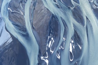 Stunning aerial drone photograph showcasing the complex, natural river patterns and icy textures