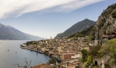 A picturesque view of Limone Sul Garda, Italy, nestled between Lake Garda and steep mountains The
