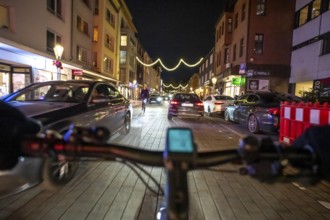 Cycling in the city, in the dark, in the evening, inner-city road, bicycle road, two-wheeler